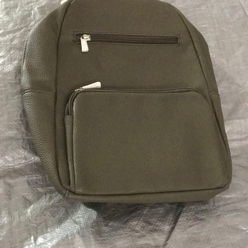 Green Backpack with Classic Design and Durable Material. By Thirty One. Is new!
